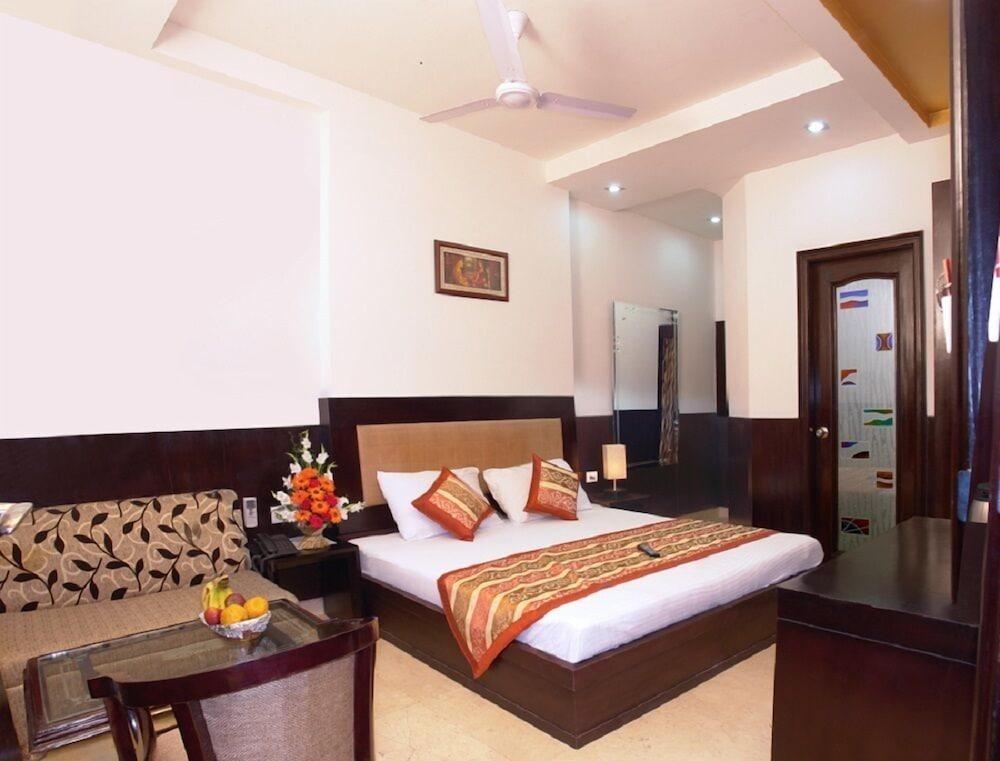 Hotel Apra Deluxe New Delhi Værelse billede
